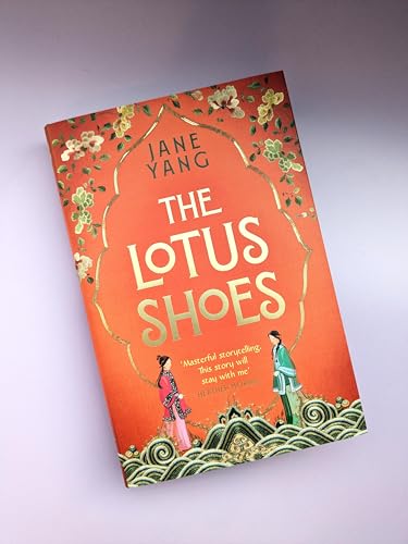Book cover for “The Lotus Shoes” with orange background and floral design.