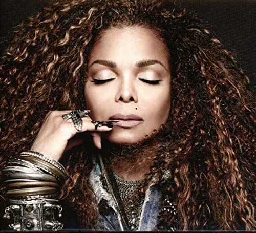Janet Jackson album cover, close-up portrait with curly hair and jewelry.