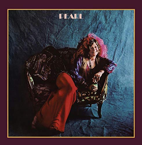 Janis Joplin sits in an ornate chair against a blue textured backdrop on Pearl cover.