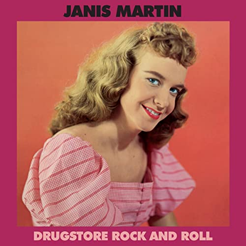 Janis Martin album cover, smiling woman in pink gingham, orange background.