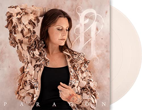 Vinyl record cover featuring a woman in a textured jacket and white disc.