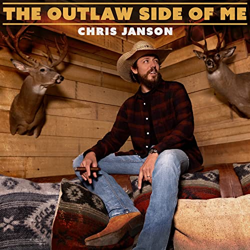 Chris Janson album cover featuring the artist with deer mounts.
