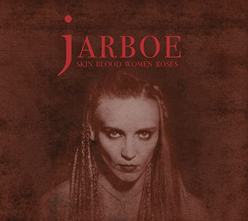 Jarboe CD cover: woman with braided hair against a red textured background.