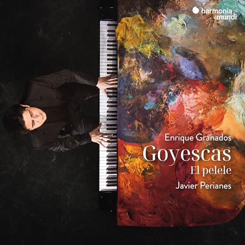 Pianist Javier Perianes at a piano with abstract, colorful artwork.