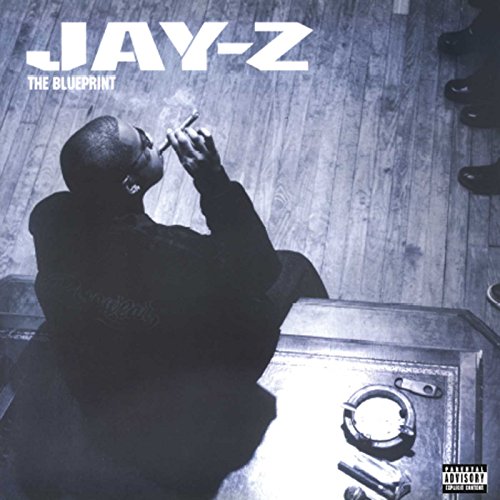 "Jay-Z album cover featuring a man smoking, with handcuffs on a table."