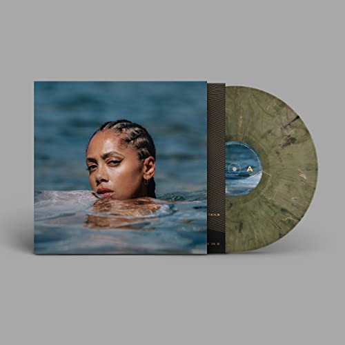 Album cover showing a woman in water next to a marbled green vinyl disc.
