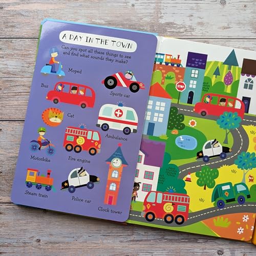 Open children’s book with colorful illustrations of vehicles and a town scene.