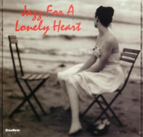 CD cover: woman sitting on a chair by the sea.
