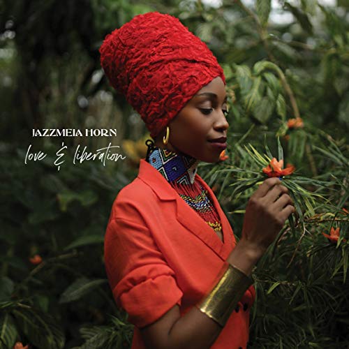 Woman in red clothing and headwrap holding flowers, surrounded by greenery, on album cover.