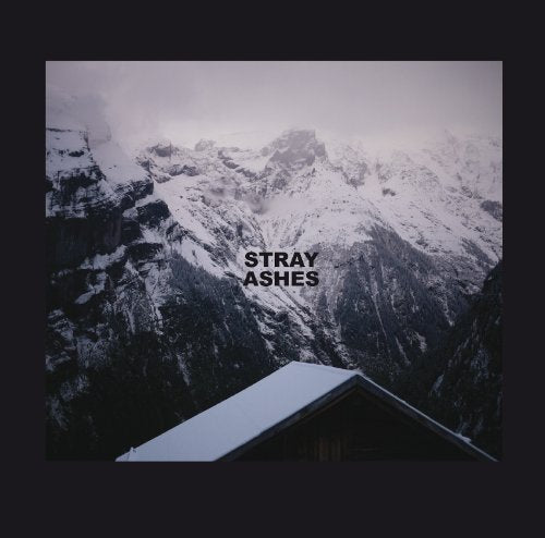 "Album cover with snowy mountain landscape and 'STRAY ASHES' text on a dark background."