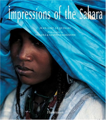 Book cover: portrait of a woman in blue headwrap, Sahara desert.