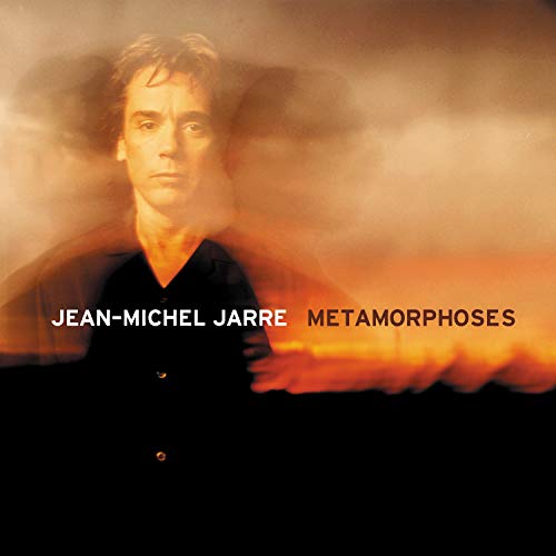 Jean-Michel Jarre album cover, portrait with orange and black smoky background.