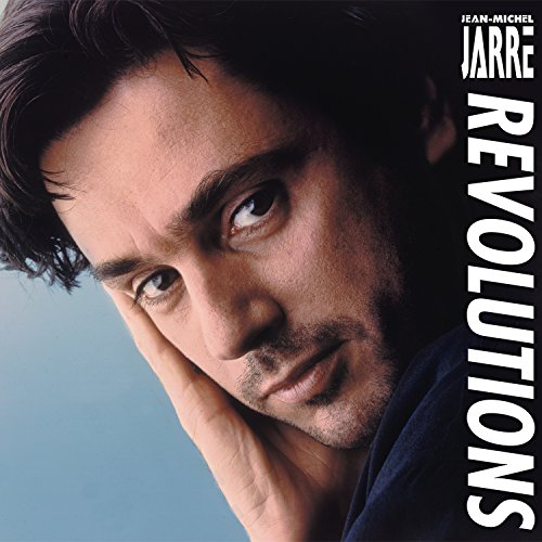 Man with dark hair resting head on hand, blue background, "Revolutions" album cover.