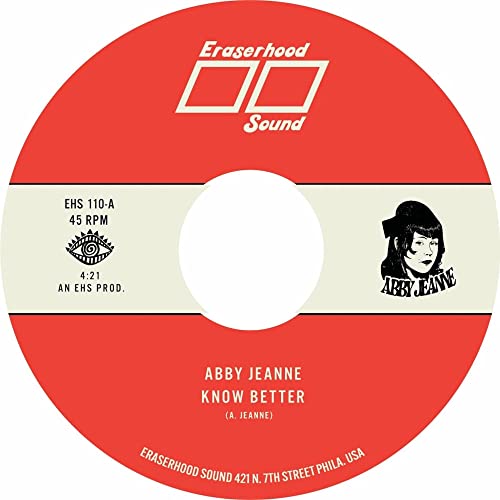 Red and cream vinyl record label with artist portrait and text.