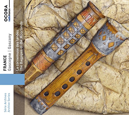 "CD cover featuring two ornate bagpipes on a stone background."