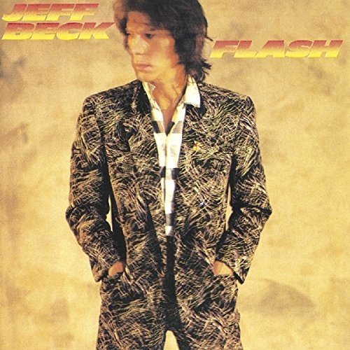 "Album cover featuring Jeff Beck in a patterned suit against a mottled beige background."