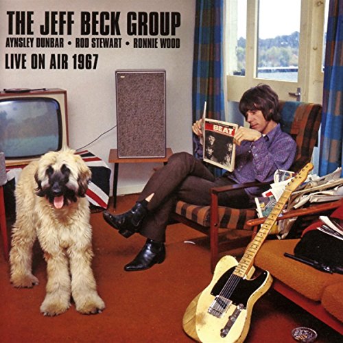 CD cover: man with guitar, dog, and vintage room setting.