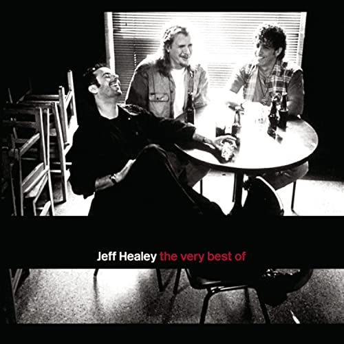 Black and white photo of three men sitting at a table, with album title text.