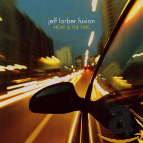 CD cover for Jeff Lorber Fusion’s “Now is the Time” with city lights.