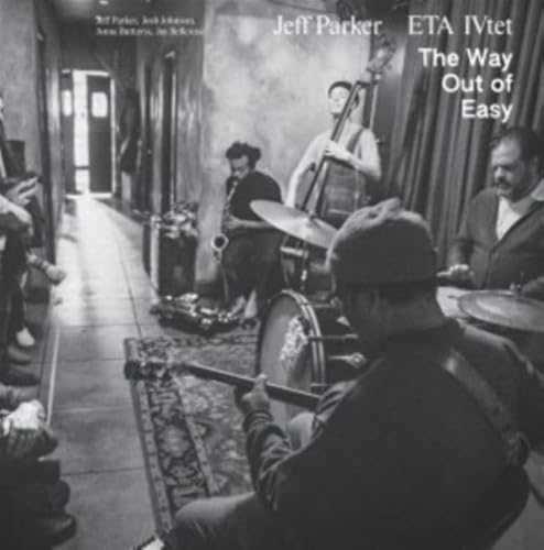 Black and white vinyl album cover featuring jazz musicians performing.