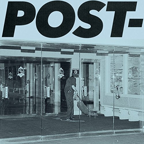 Black and white album cover featuring a person sweeping in front of a building.