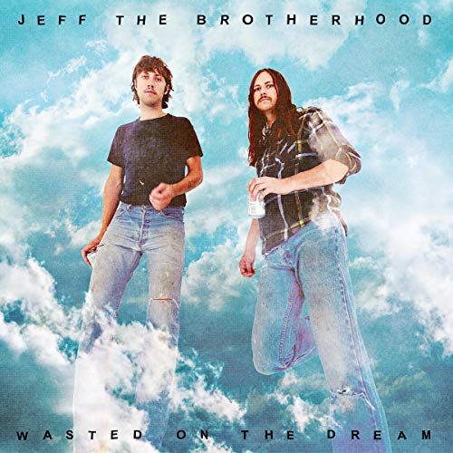 Album cover with two men floating in a cloudy sky.