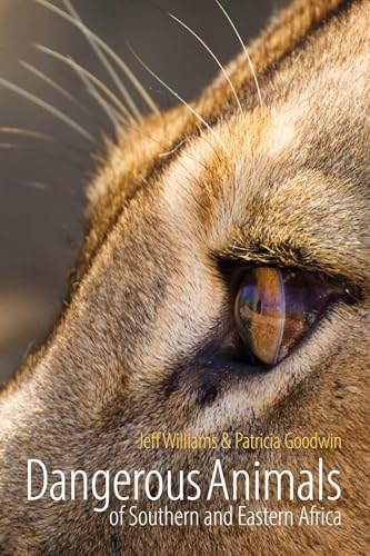 Close-up of a lion’s eye on the cover of a wildlife book.