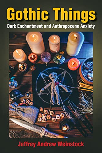 Book cover with voodoo doll, candles, crystals, and occult symbols.