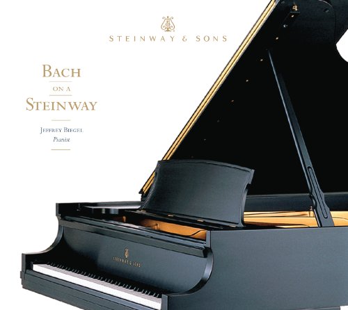 Black Steinway grand piano with sheet music, album cover art.