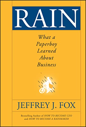 Yellow book cover with "RAIN" title and a paperboy silhouette.