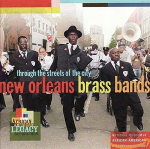 CD cover featuring a New Orleans brass band marching down a street.