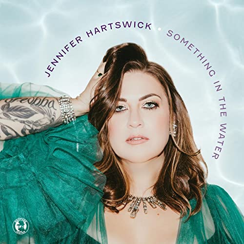 Jennifer Hartswick album cover, portrait of a woman in teal fabric.