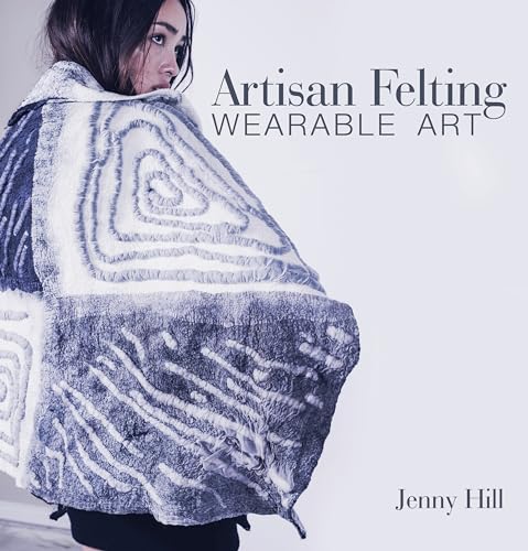 Woman wearing a swirling, textured, gray and white felted wrap or cloak.