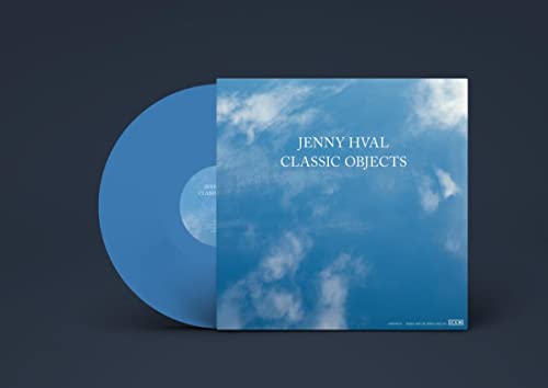 Blue vinyl record and album cover featuring a blue sky with white clouds.