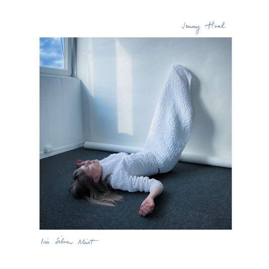 Album cover: woman lying near a window, titled “Iris Silver Mist”.