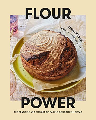 Book cover featuring a rustic sourdough loaf on parchment paper.