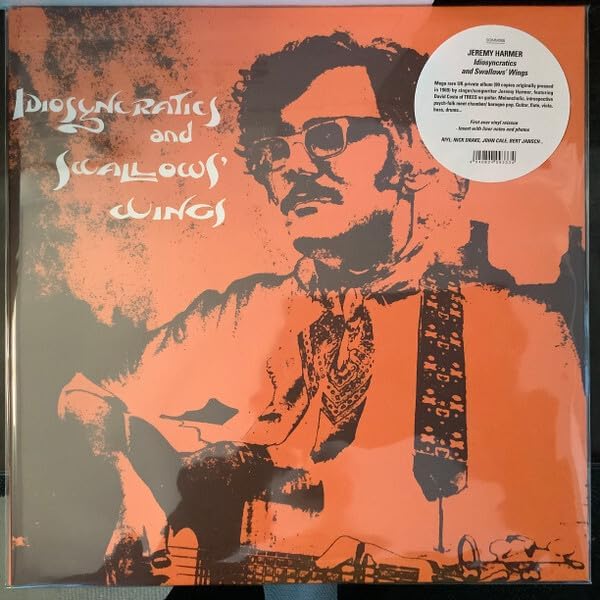 Vinyl record cover featuring a sepia-toned portrait of a man with glasses.