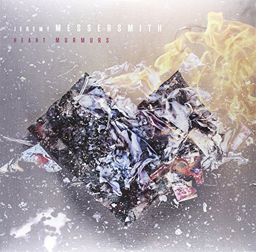 Vinyl album cover with burning, crumpled paper and artist's name in white text.