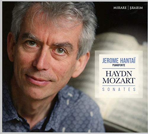 CD cover featuring a man with gray hair and a blue shirt.