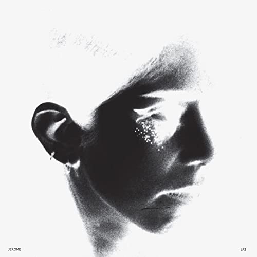 Black and white album cover featuring a blurred portrait of a man.
