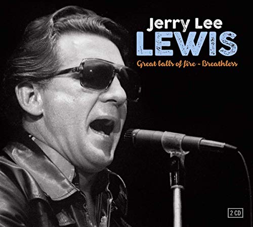Black and white portrait of Jerry Lee Lewis singing into a microphone.