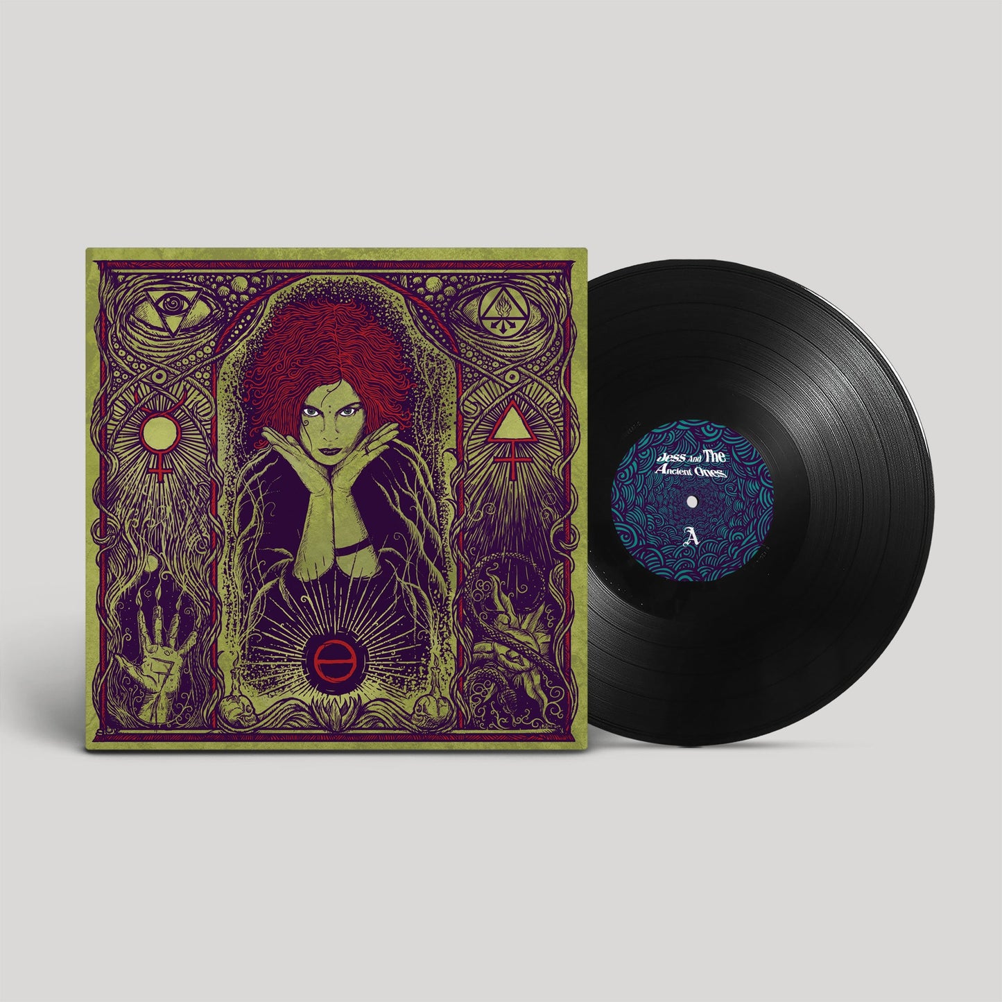 Vinyl record and cover art featuring a woman with red hair.