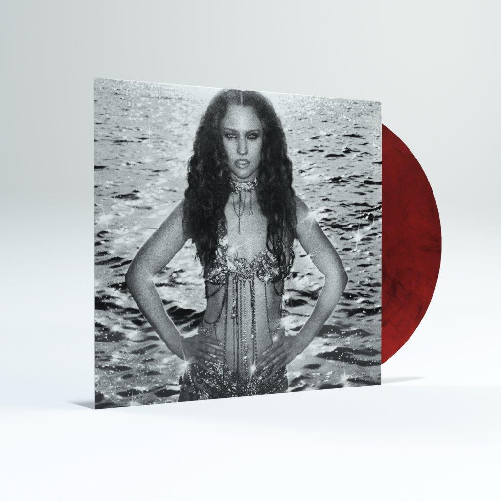 Jess Glynne album cover with a woman in water and a red vinyl disc.