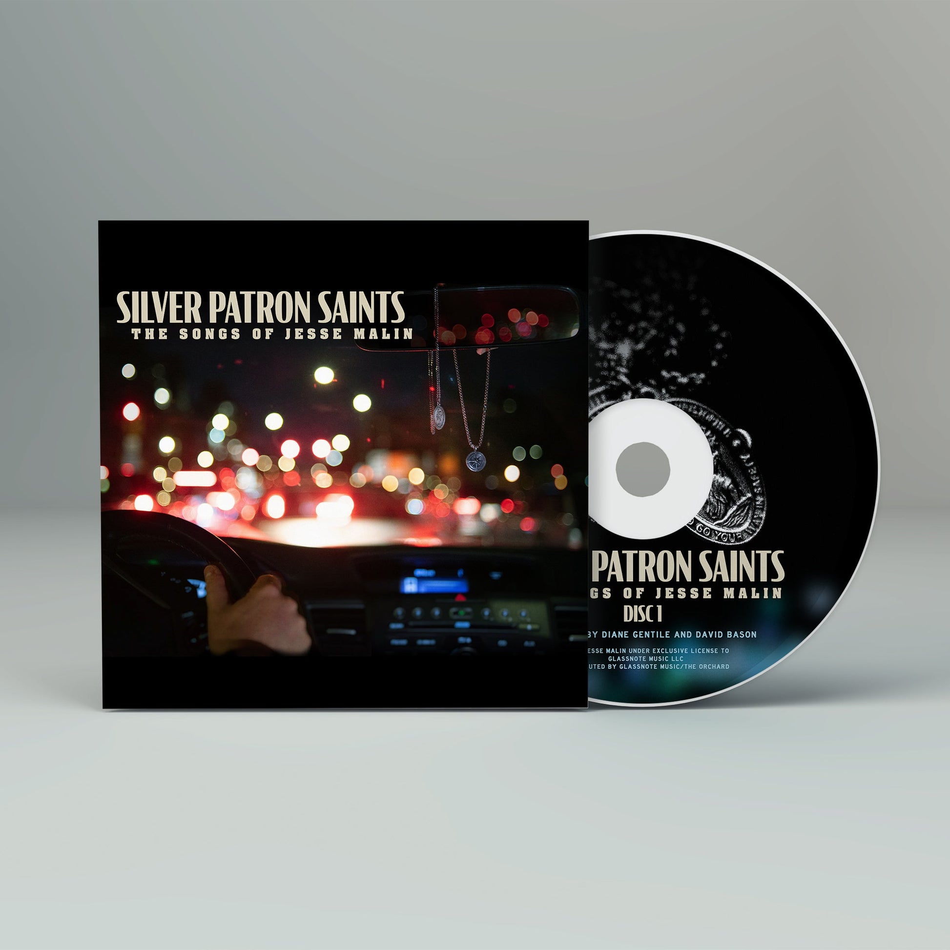 CD case for Jesse Malin’s “Silver Patron Saints” with necklace imagery.