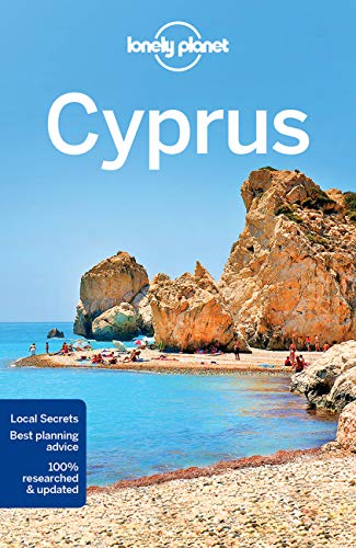 Lonely Planet Cyprus travel guide cover featuring rocky cliffs, a beach, and blue sea.