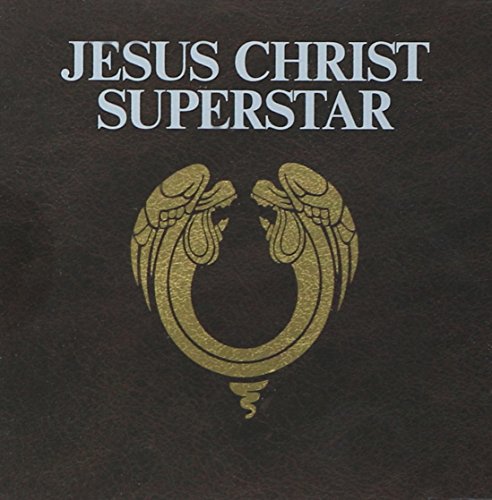 Jesus Christ Superstar album cover with gold angel wings on a dark brown background.