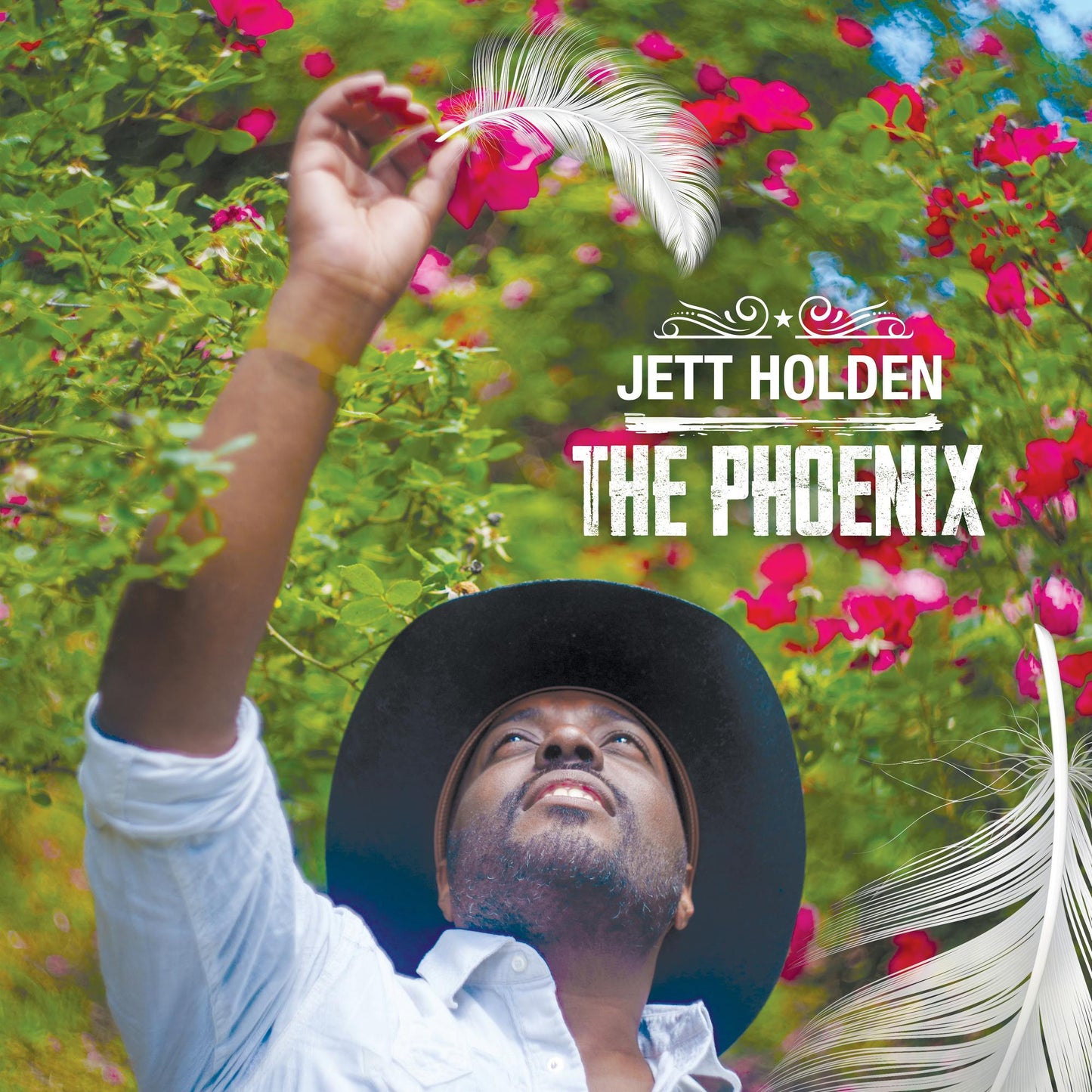 Album cover featuring a man in a hat looking up amidst roses and feathers.