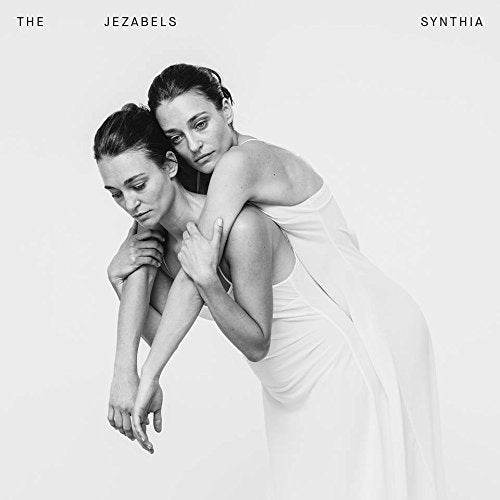Black and white album cover featuring two women embracing.