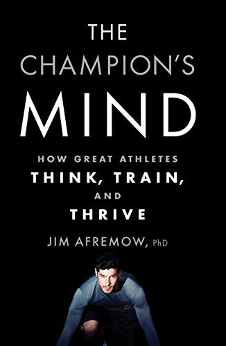 Book cover with white text on black background featuring a crouched male athlete.