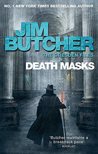 Book cover: man with staff stands in a stone hallway.